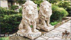 Statuetă leu în șezut, galben patinat, model S46.